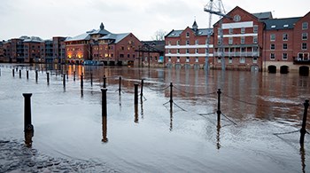 flooded-buildings-by-river.jpg